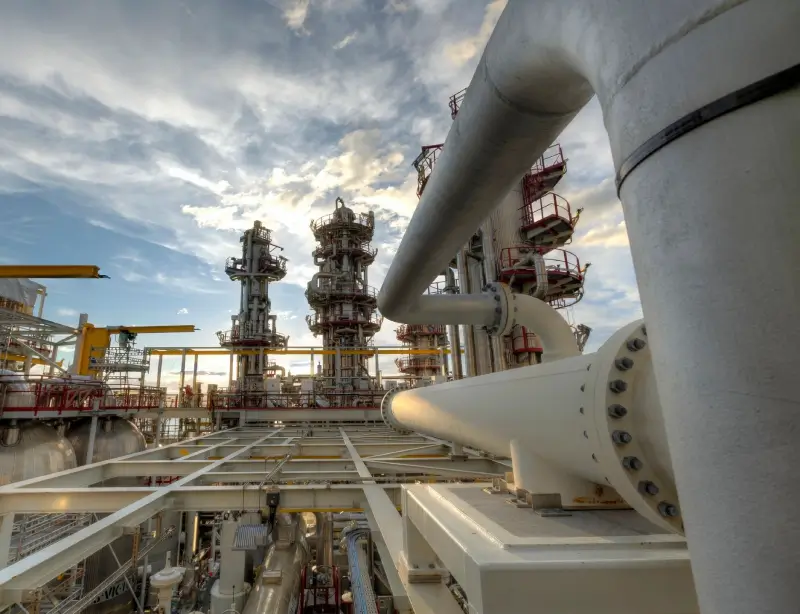 A large oil refinery with pipes and valves.