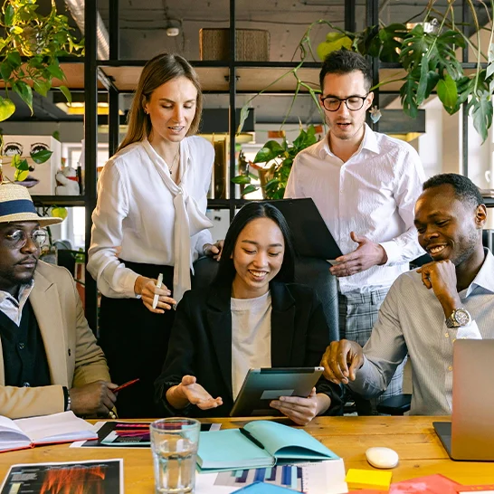 A group of people sitting around a table.